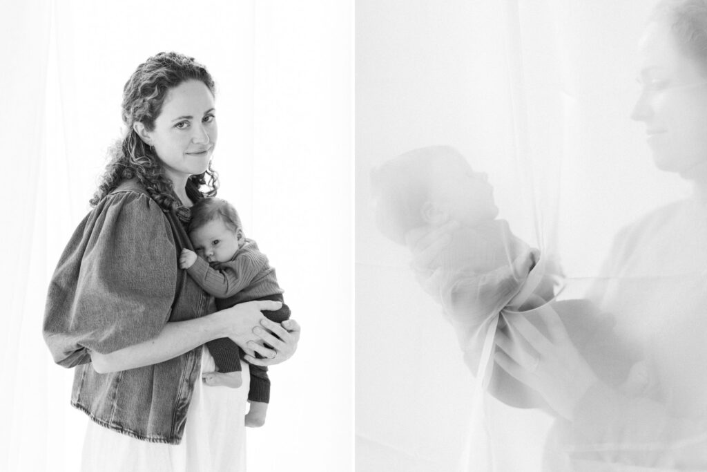 Mother smiling and cuddling newborn in a bright studio during a Coeur d'Alene Studio Petite Session with white walls and natural light