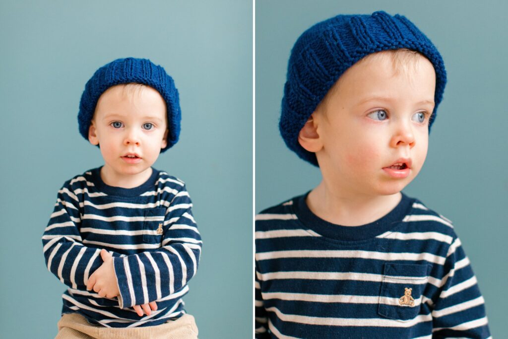 Toddler milestone session during a Coeur d'Alene Studio Petite Session, looking into the camera, pensive and full of curiosity