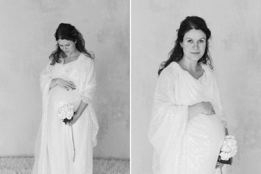 black and white of pregnant mom in gown in a natural light studio looking at the camera in coeur d'alene Idaho