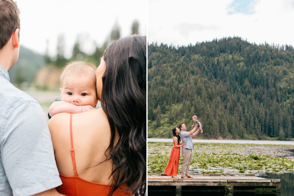 toddler teething and mom and dad playing peek a boo with baby beside coeur d'alene lake with the mountains in the background