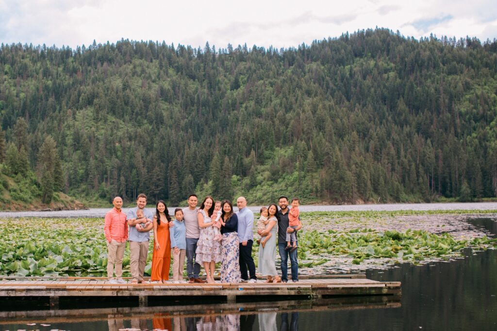 extended family with kids and grandkids on a pier on the lake near Coeur d'Alene Idaho