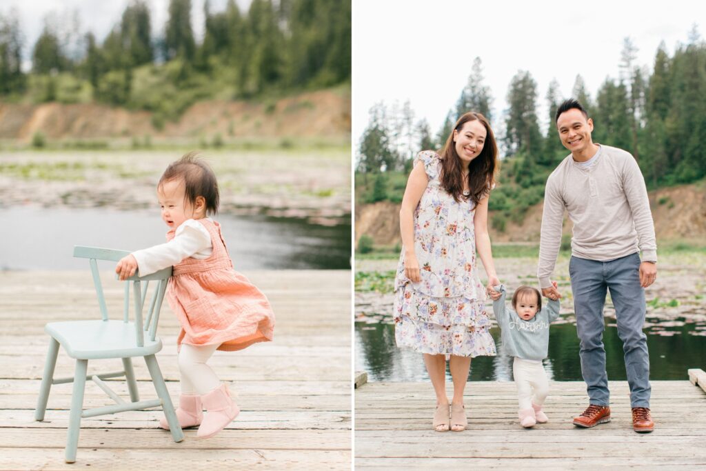 family smiling and playing with daughter beside lake coeur dalene on a windy day