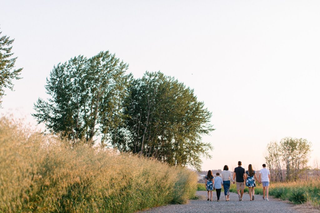 Golden hour family session in Liberty Lake tall grass field near Spokane