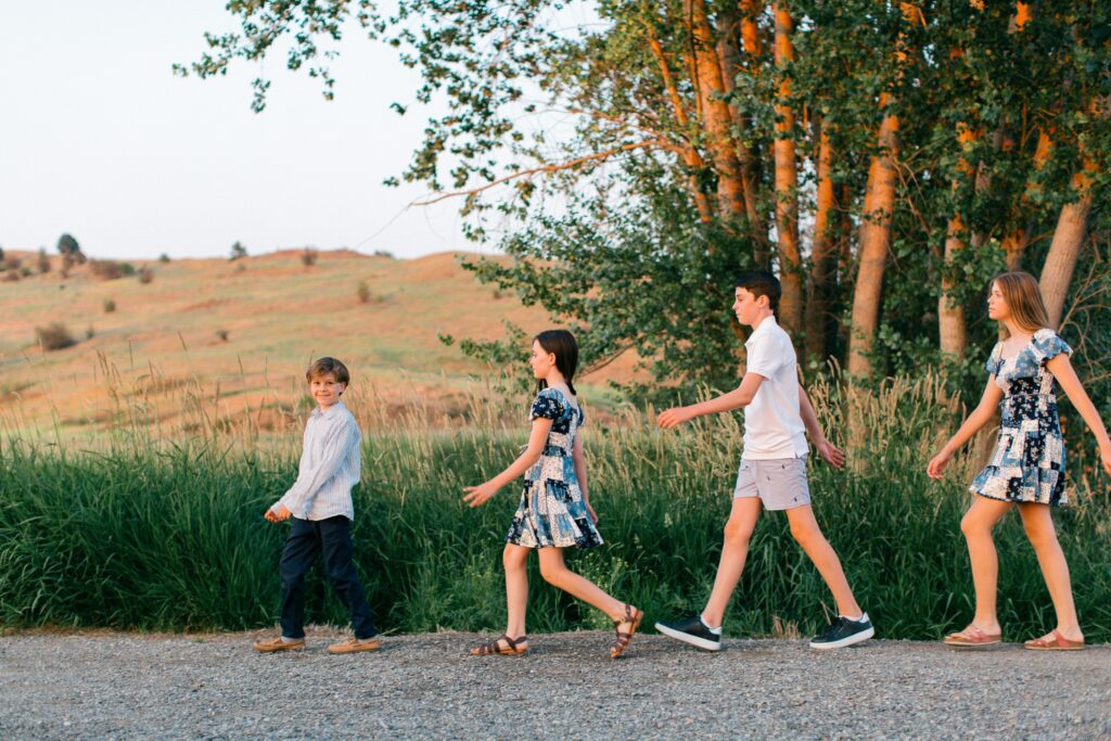 Warm sunset light during relaxed family photography session in North Idaho region