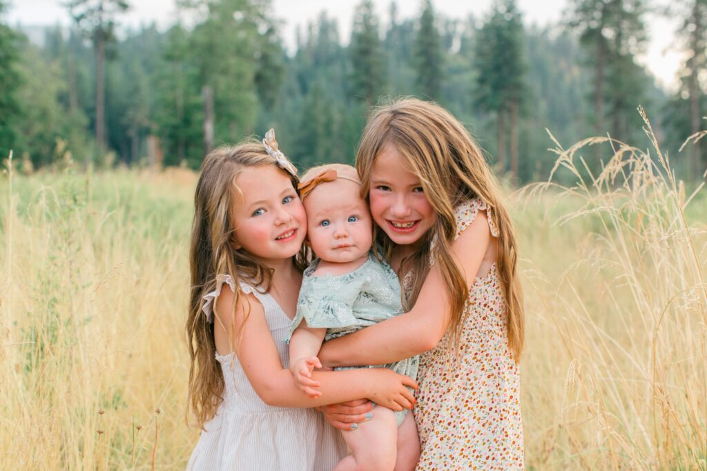 Timeless family portraits by the lake in Coeur d’Alene Idaho at sunset