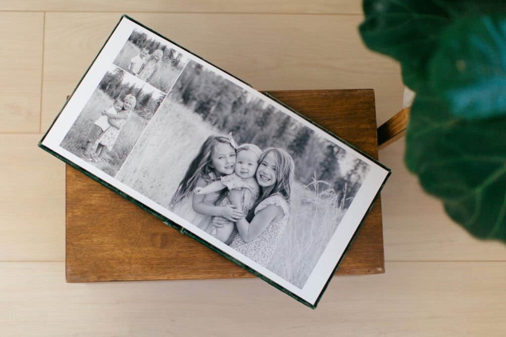 Lifestyle image of family photography album showcasing outdoor golden hour session