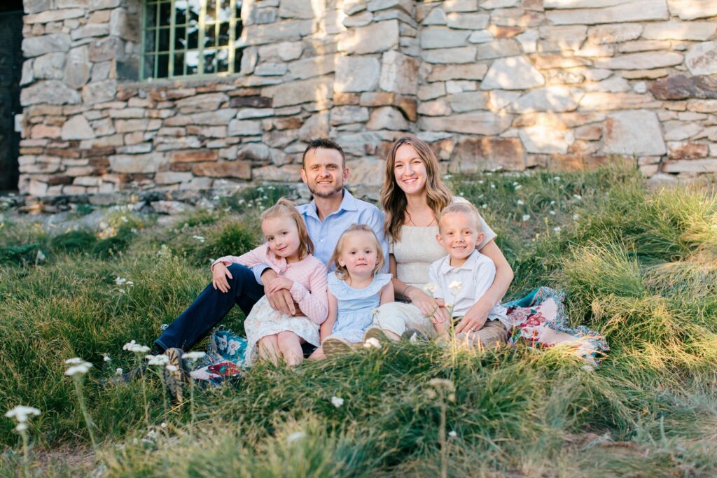 Golden hour family portraits on Mt Spokane with wildflowers and scenic views