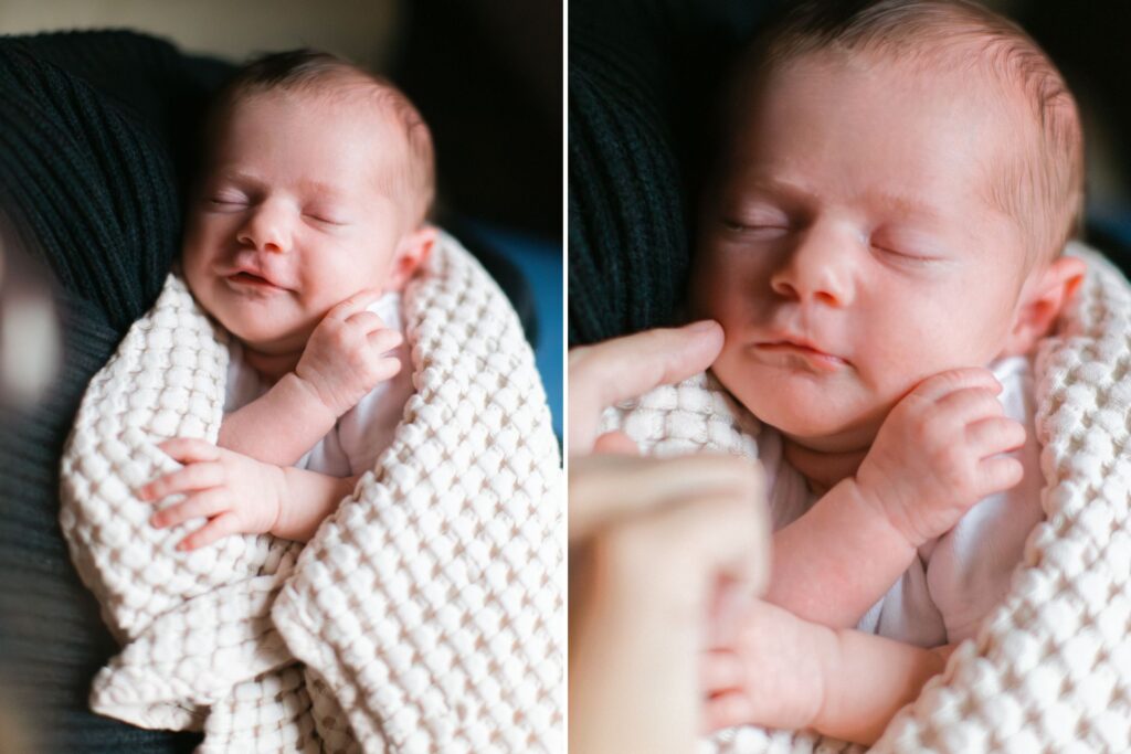 Newborn baby girl wrapped in a cream knit blanket resting in her mom's arms near a sun-lit window in Spokane