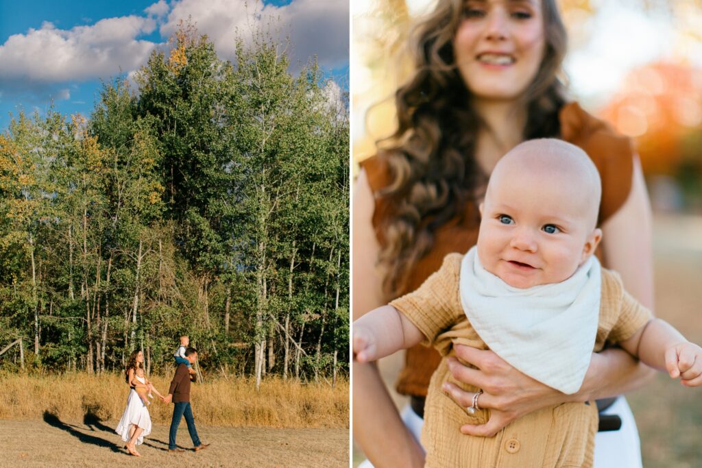 mom holding laughing baby and whole family walking in front of fall foliage under blue skies in north idaho